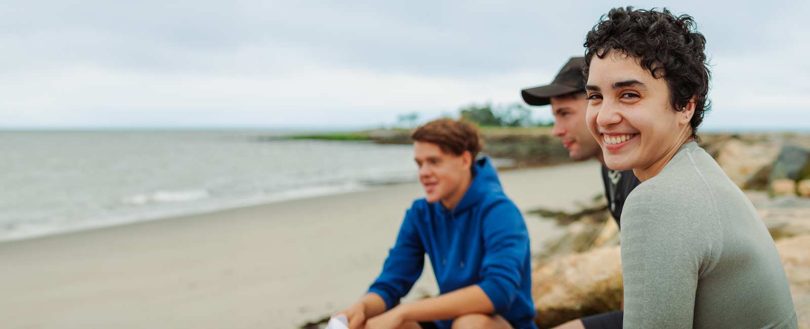 Smiling UB Students on the beach