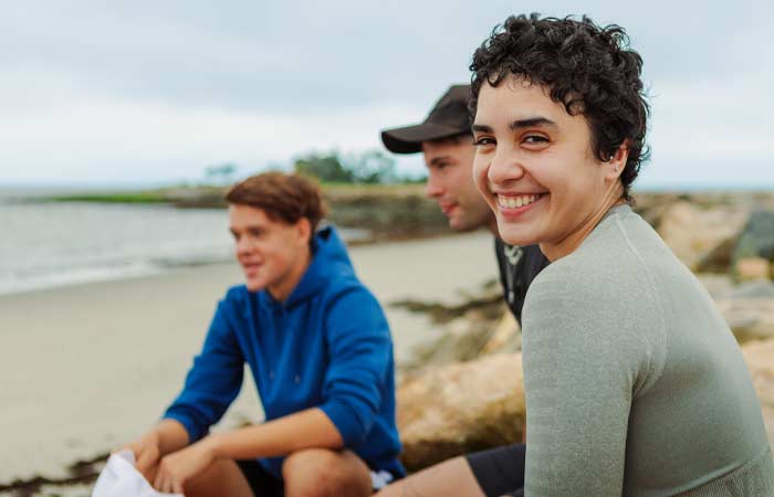 Smiling UB Students on the beach