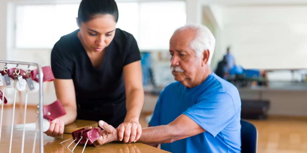 Pre-Occupational Therapy Health Sciences concentration student working with a patient