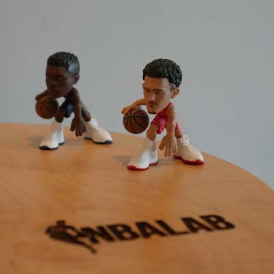 basketball player figurines on an NBALab table