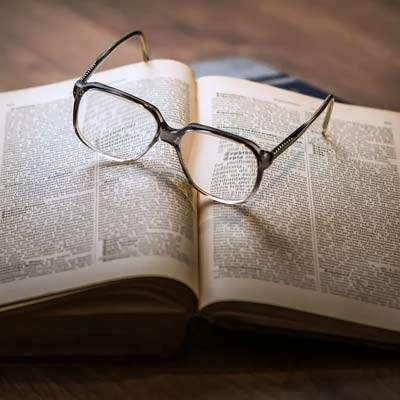 glasses on an open book