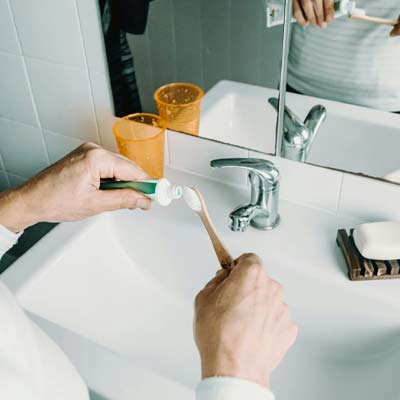 person preparing to brush their teeth