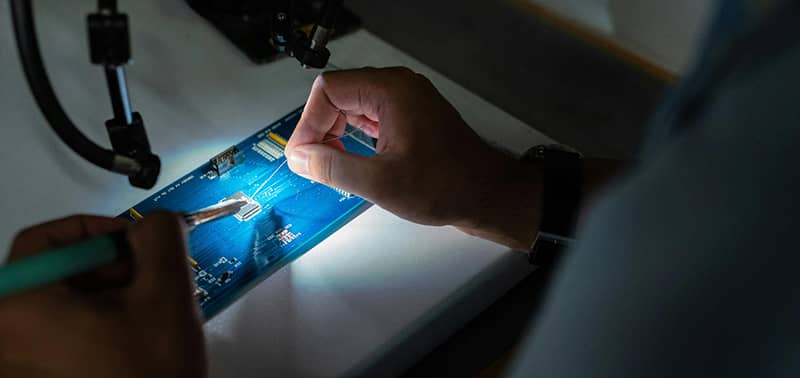 computer chip being soldered