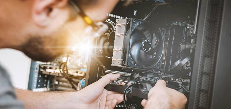 person replacing a computer component