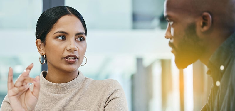 two mba students discussing coursework