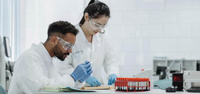 Two students analyzing samples