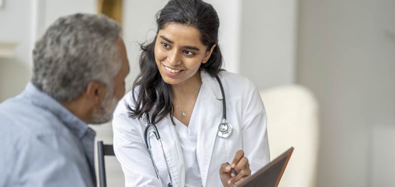 nurse speaking with a patient