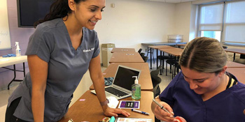 A student at UB, one of the best online dental hygiene master’s programs in CT