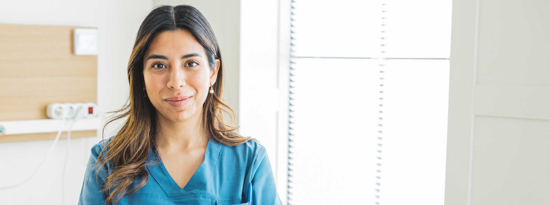 Nursing student in scrubs