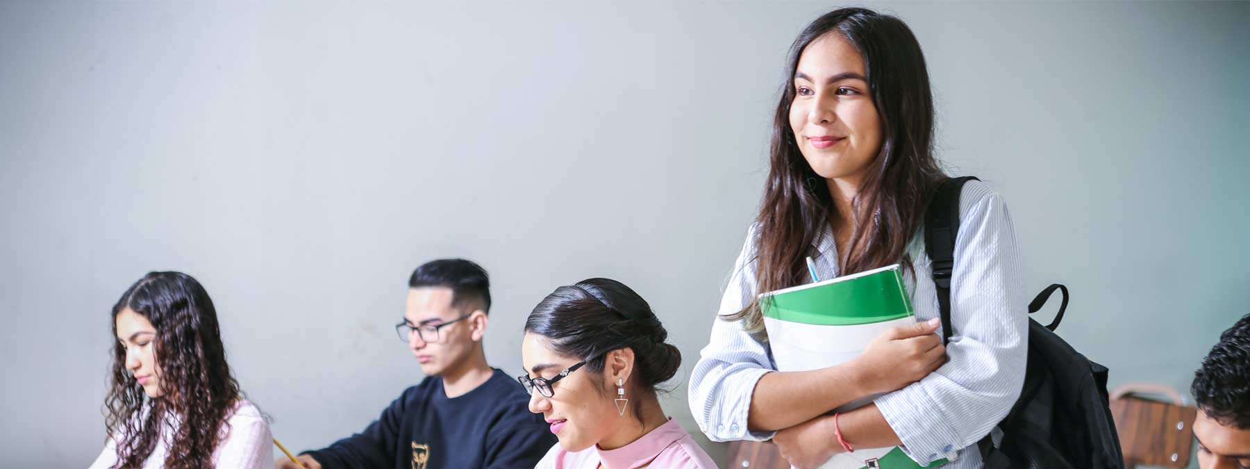 student walking into a classroom